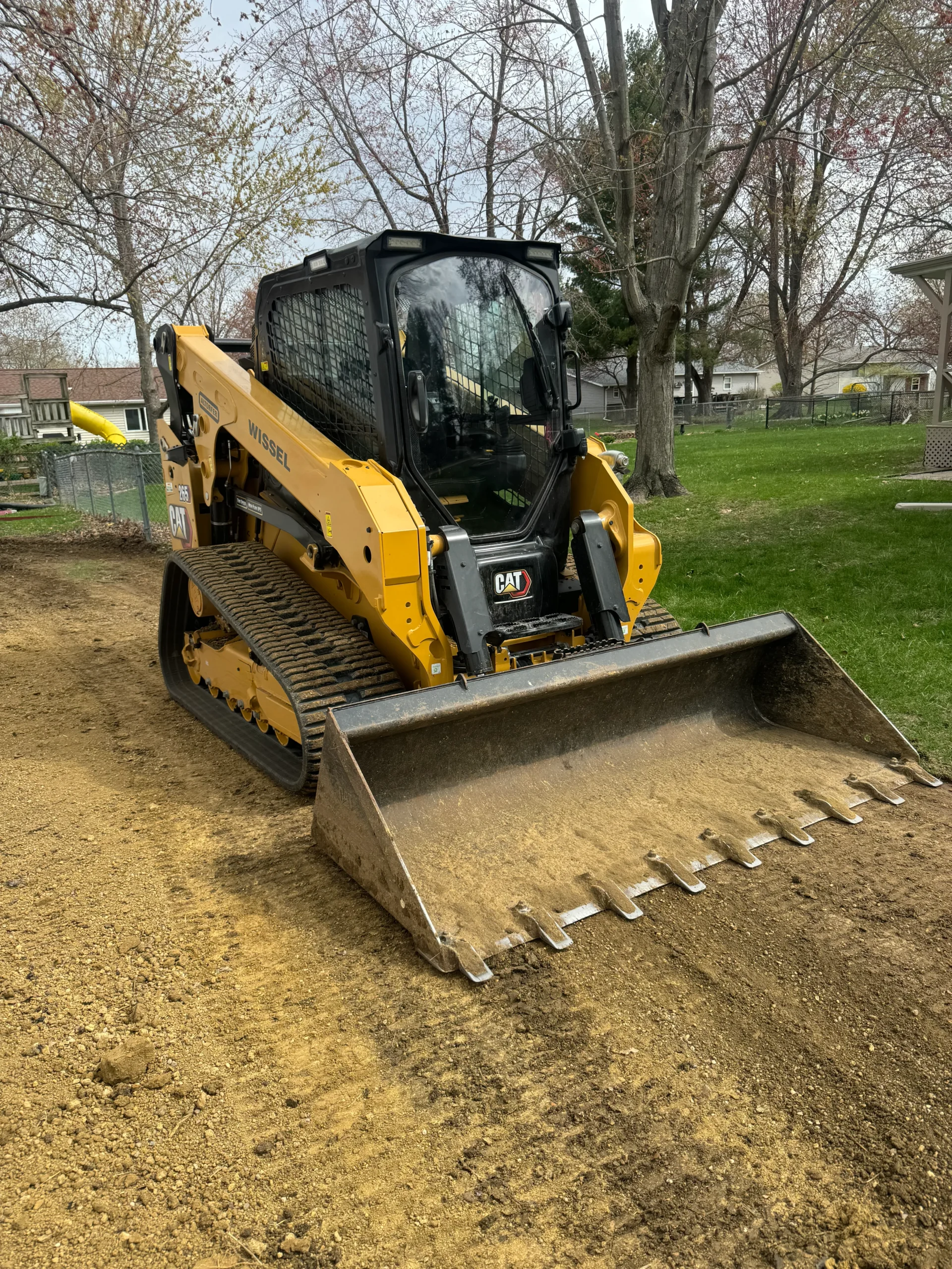 Caterpillar Skid Steer Loader Caterpillar skid steer loader with a front bucket on a construction site.